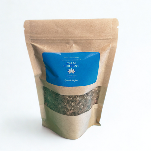 Kraft paper packaging with a light blue label by Trees Leaves Teas on a white background