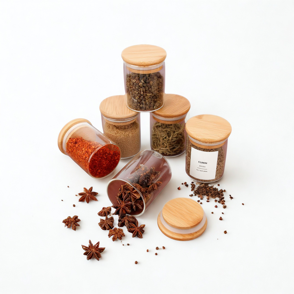 Set of spice jars with wooden lids on a white background