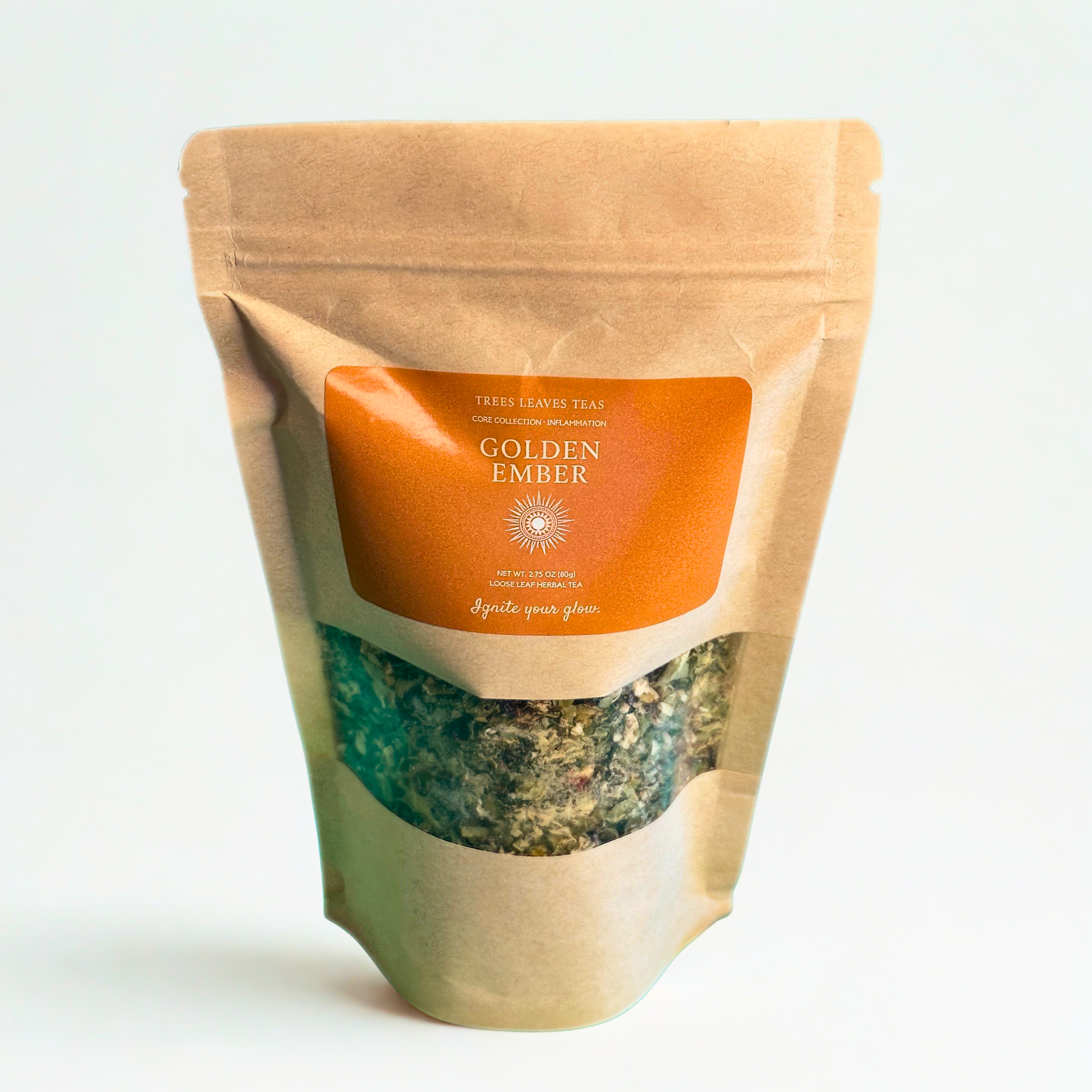 Tea package labeled 'Golden Ember' with a clear window showing tea leaves inside on a white background.