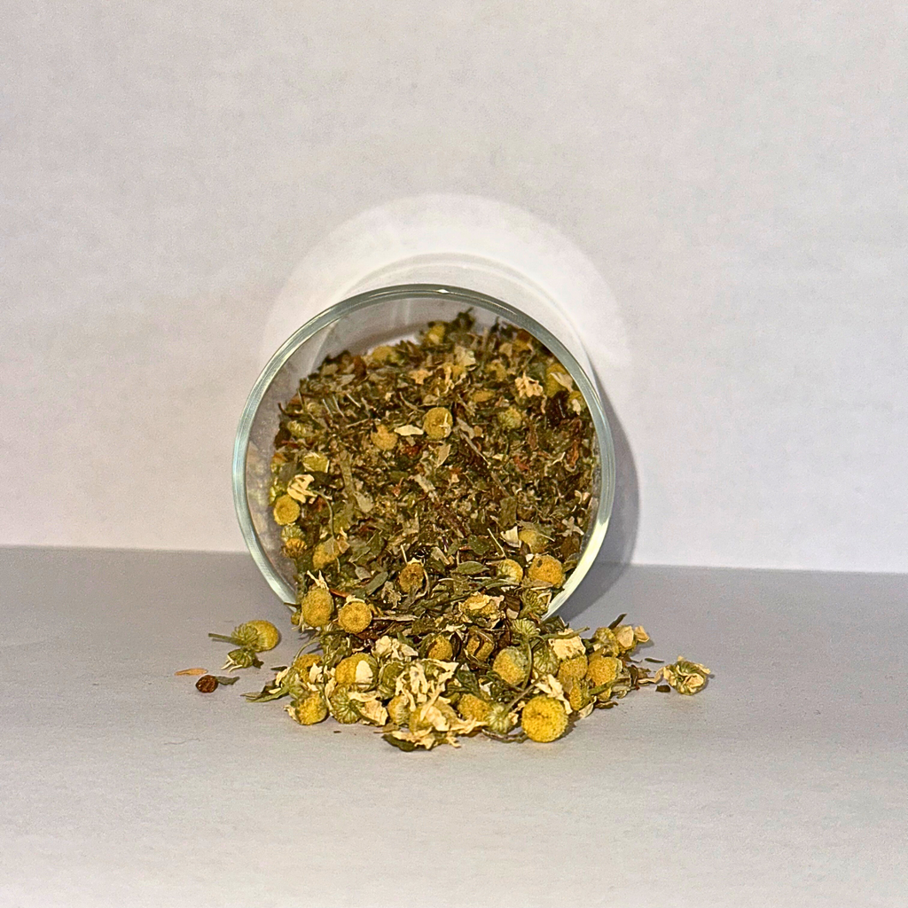 Spilling dried herbs from a glass jar