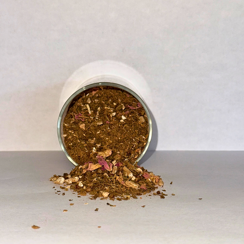 Spilling dried herbs from a glass jar